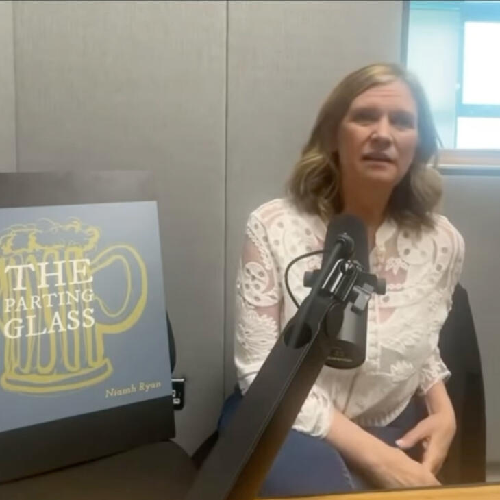 Our News A lady speaking into a microphone